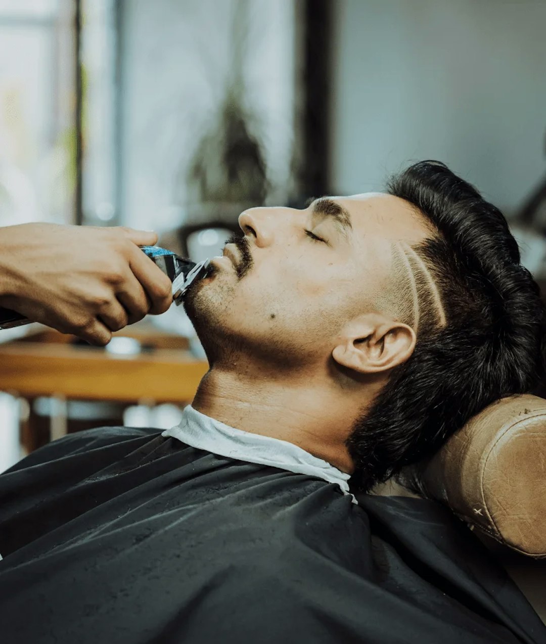 Barber doing a customer's haircut